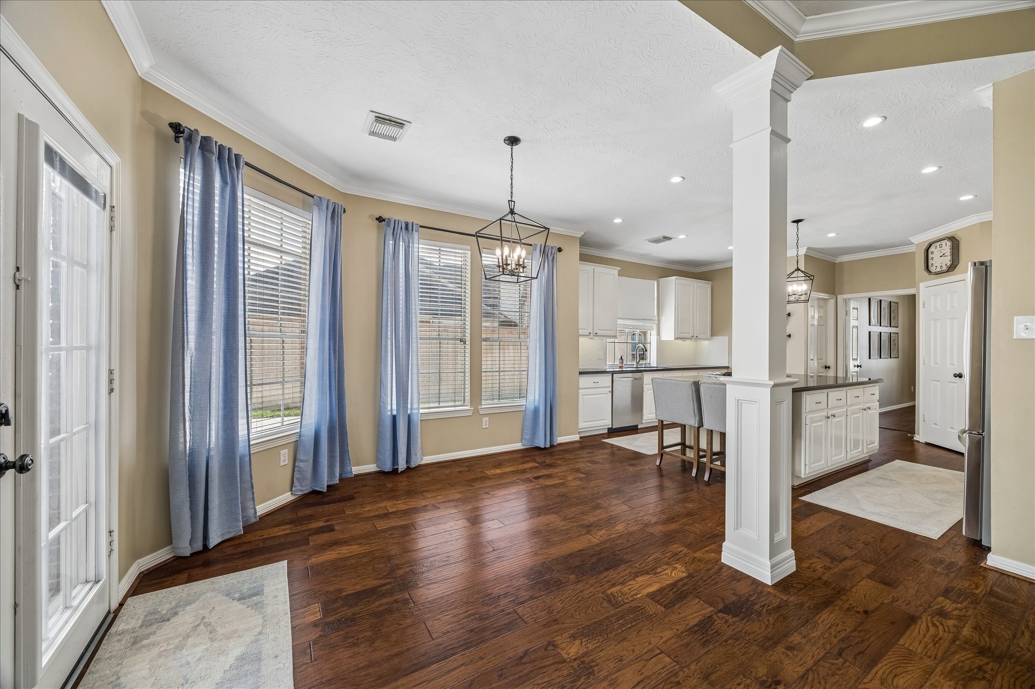 5310 Summerland Ridge Court Houston, TX 77041 - Photo 20 of 46 a view of a hallway with wooden floor and a kitchen
