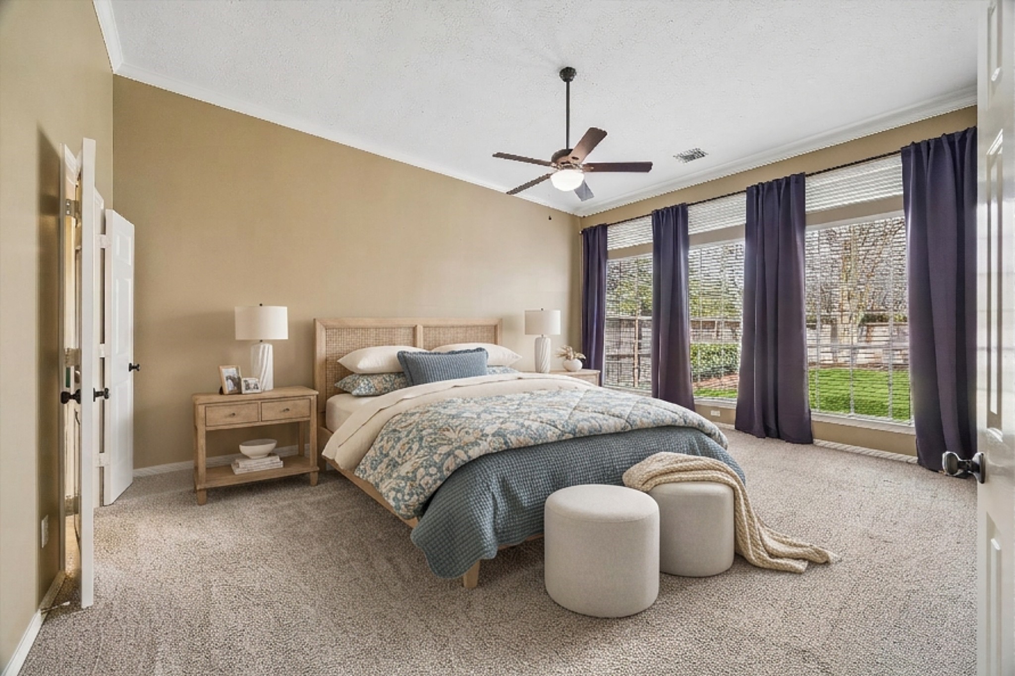 5310 Summerland Ridge Court Houston, TX 77041 - Photo 22 of 46 a spacious bedroom with a bed and large windows