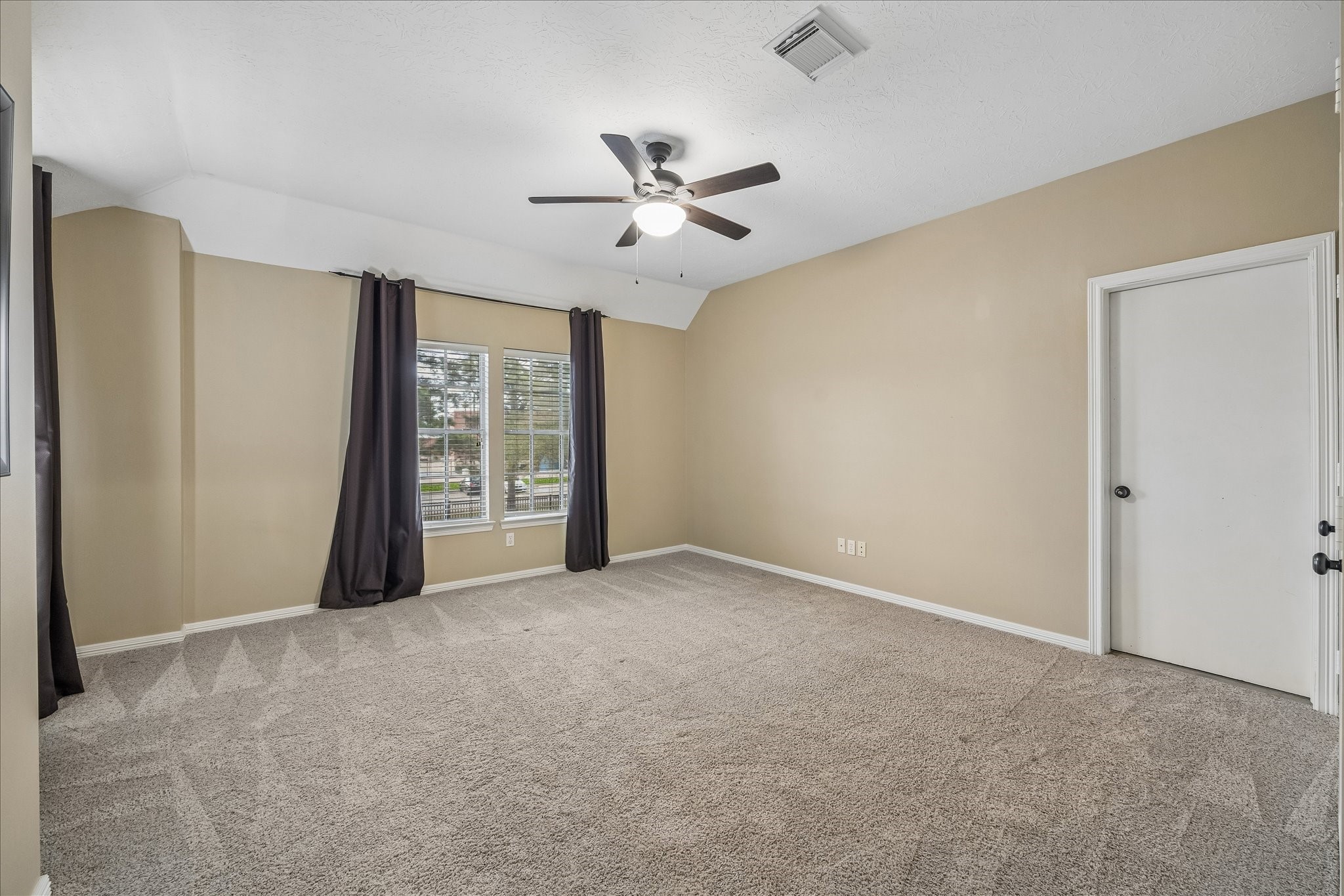 5310 Summerland Ridge Court Houston, TX 77041 - Photo 29 of 46 a view of an empty room with chandelier fan and a window