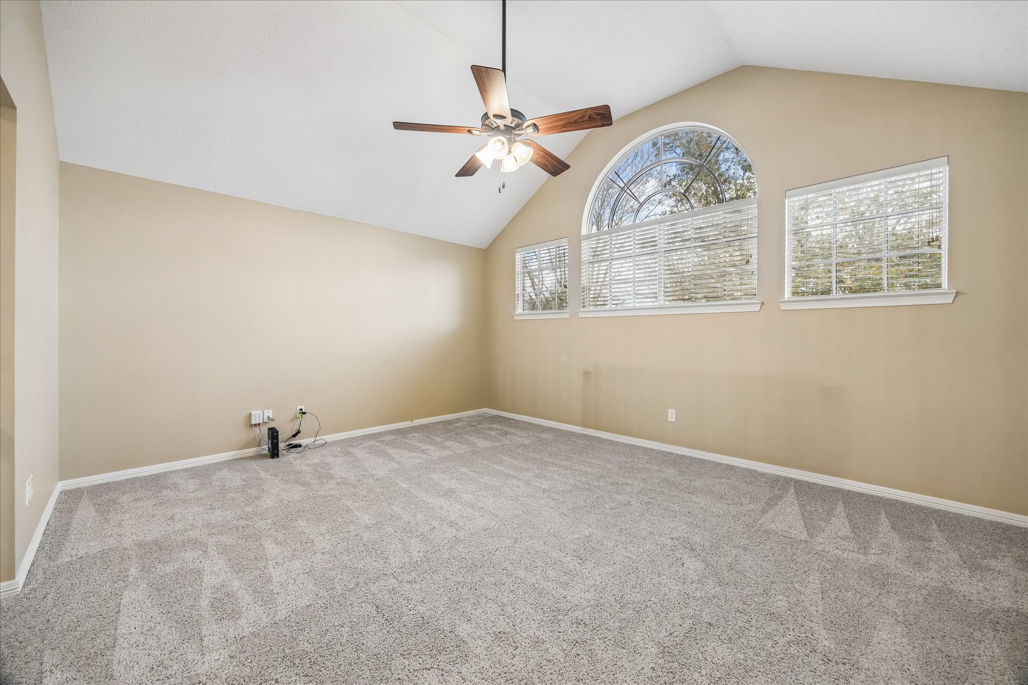 5310 Summerland Ridge Court Houston, TX 77041 - Photo 37 of 46 an empty room with windows and fan