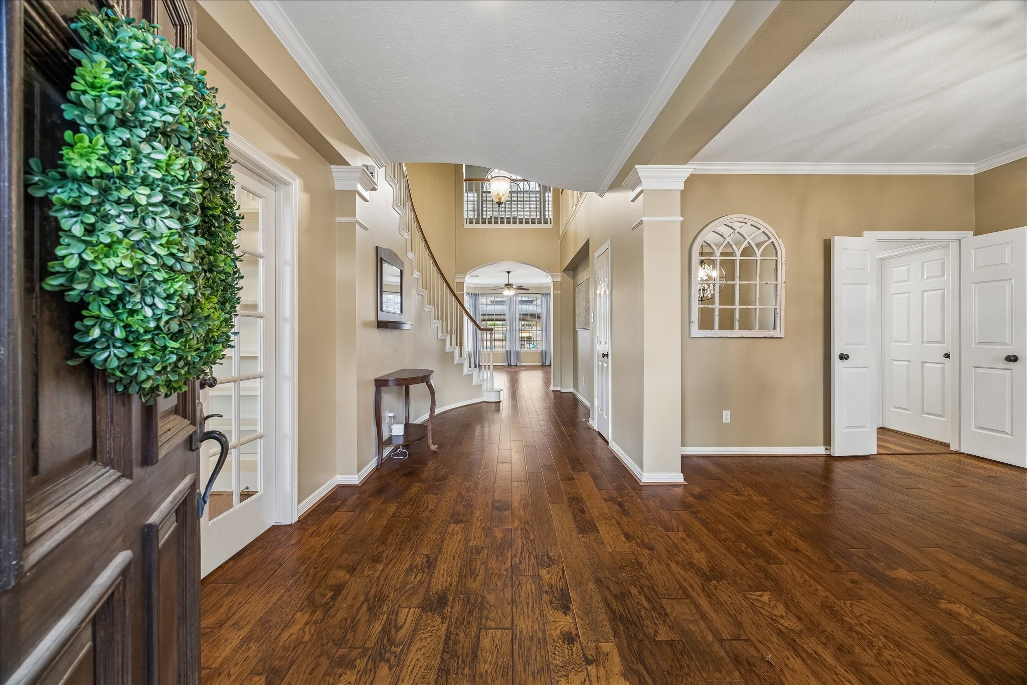 5310 Summerland Ridge Court Houston, TX 77041 - Photo 4 of 46 a view of a hallway with wooden floor and staircase