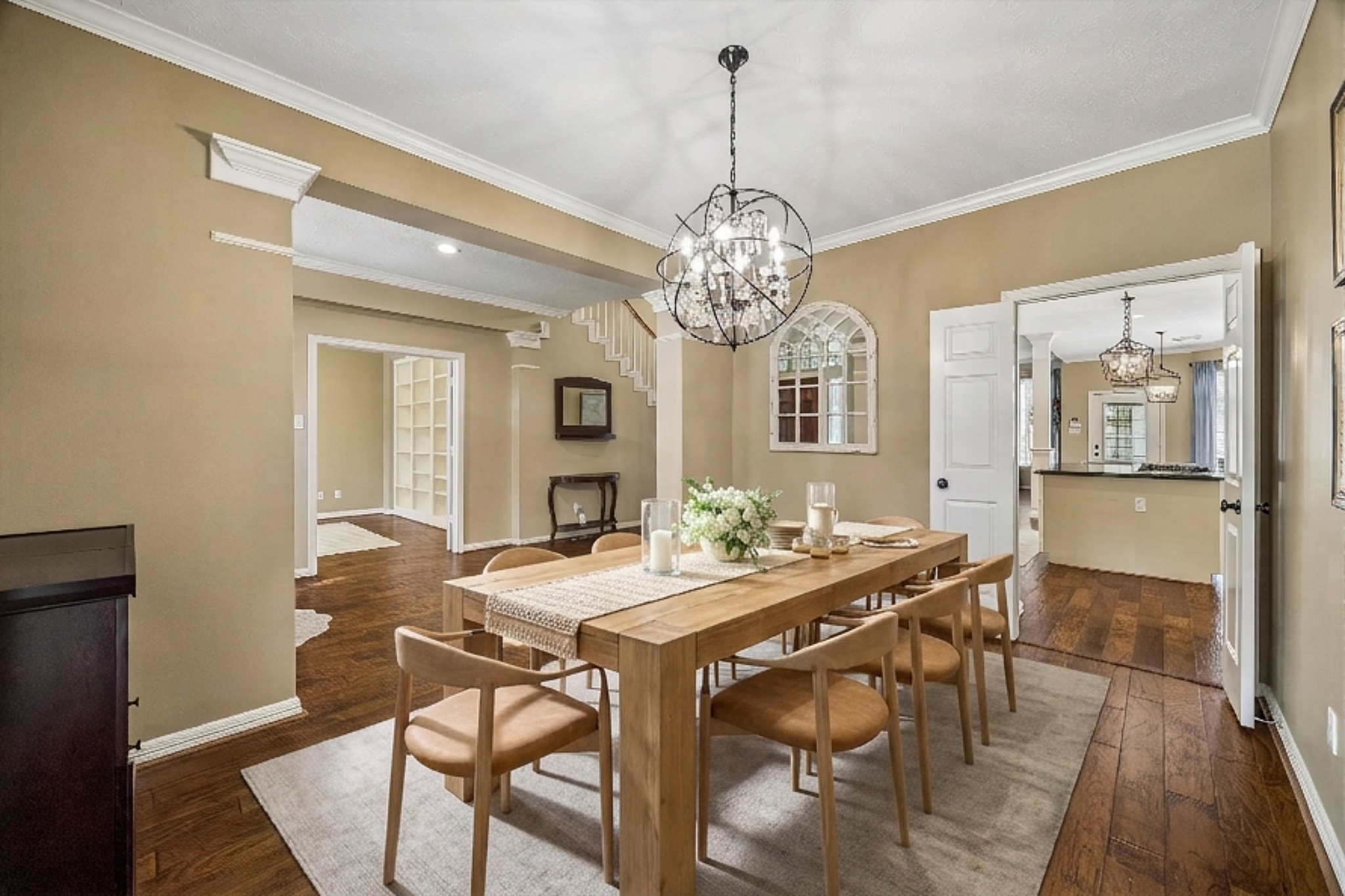 5310 Summerland Ridge Court Houston, TX 77041 - Photo 9 of 46 a view of a dining room with furniture a chandelier and wooden floor