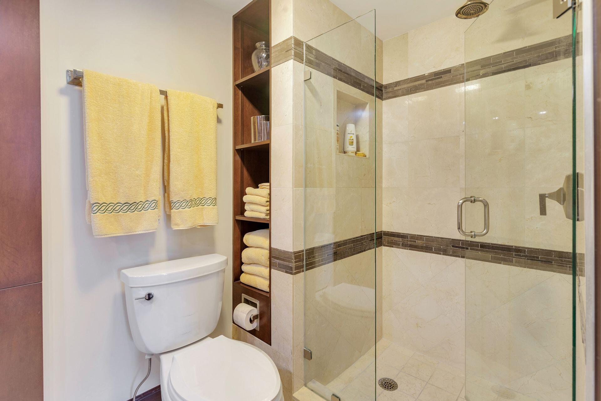 170 North Ocean Boulevard, Unit 409 Palm Beach, FL 33480 - Photo 13 of 34 a bathroom with a toilet and a shower