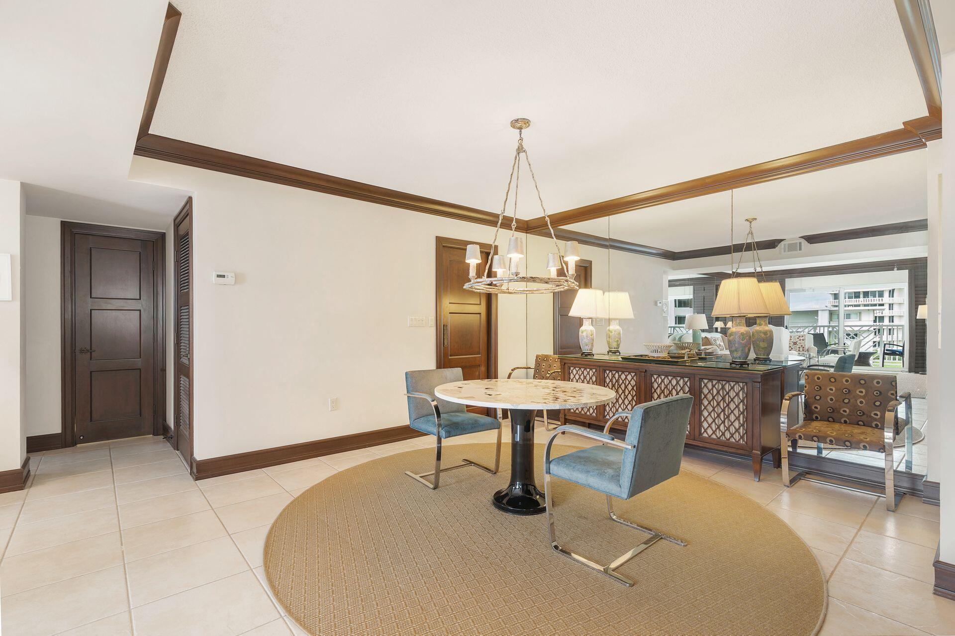 170 North Ocean Boulevard, Unit 409 Palm Beach, FL 33480 - Photo 5 of 34 a work room with furniture