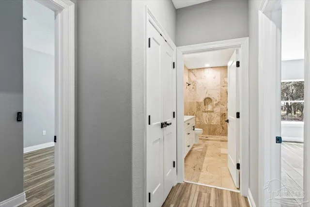 a view of a bathroom from a hallway