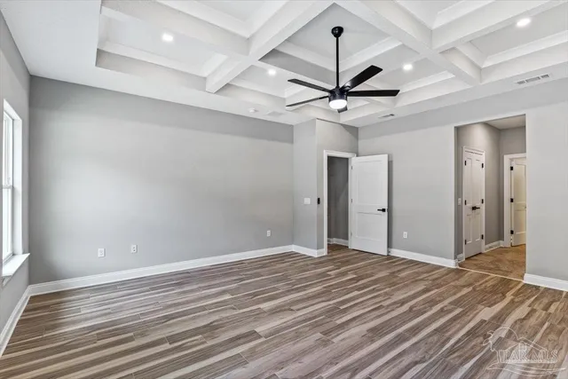 a view of a room with a ceiling fan