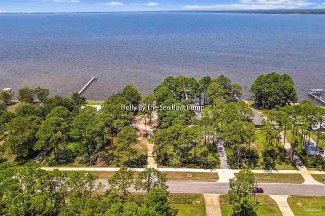 a view of a swimming pool with a yard
