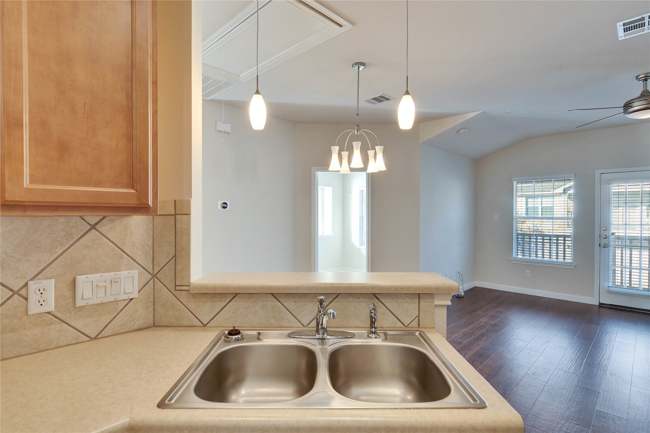 1900 Scofield Ridge Parkway, Unit 2701 Austin, TX 78727 - Photo 7 of 20 a view of a sink and dishwasher with wooden floor