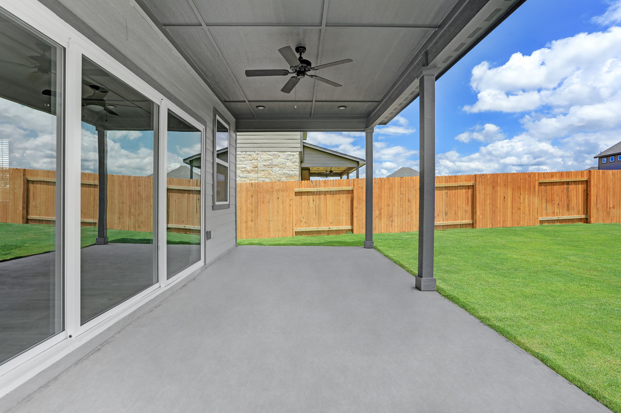 120 Periwinkle Lane Bastrop, TX 78602 - Photo 6 of 10 Beautiful sliding glass doors lead to back covered patio