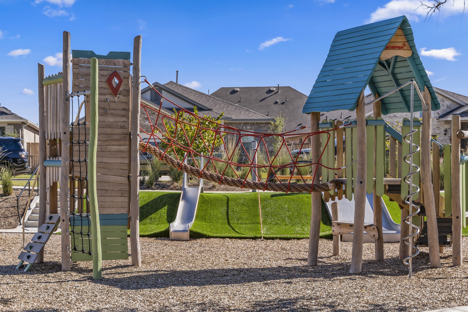 120 Periwinkle Lane Bastrop, TX 78602 - Photo 8 of 10 Playground located at The Lake House includes slides, monkey bars, climbing area, and swings!