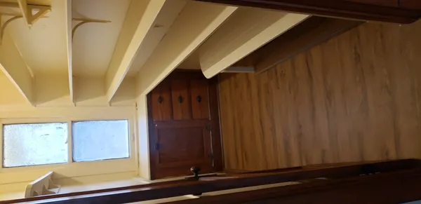 a view of a door and wooden floor