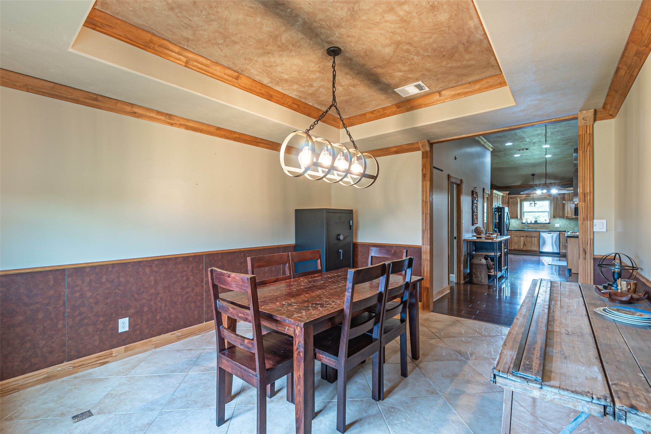 38766 Wyatt Chapel Road Hempstead, TX 77445 - Photo 23 of 45 Dining room featuring a rustic look, contemporary lighting, and warm accents, perfect for hosting gatherings and creating memorable meals.