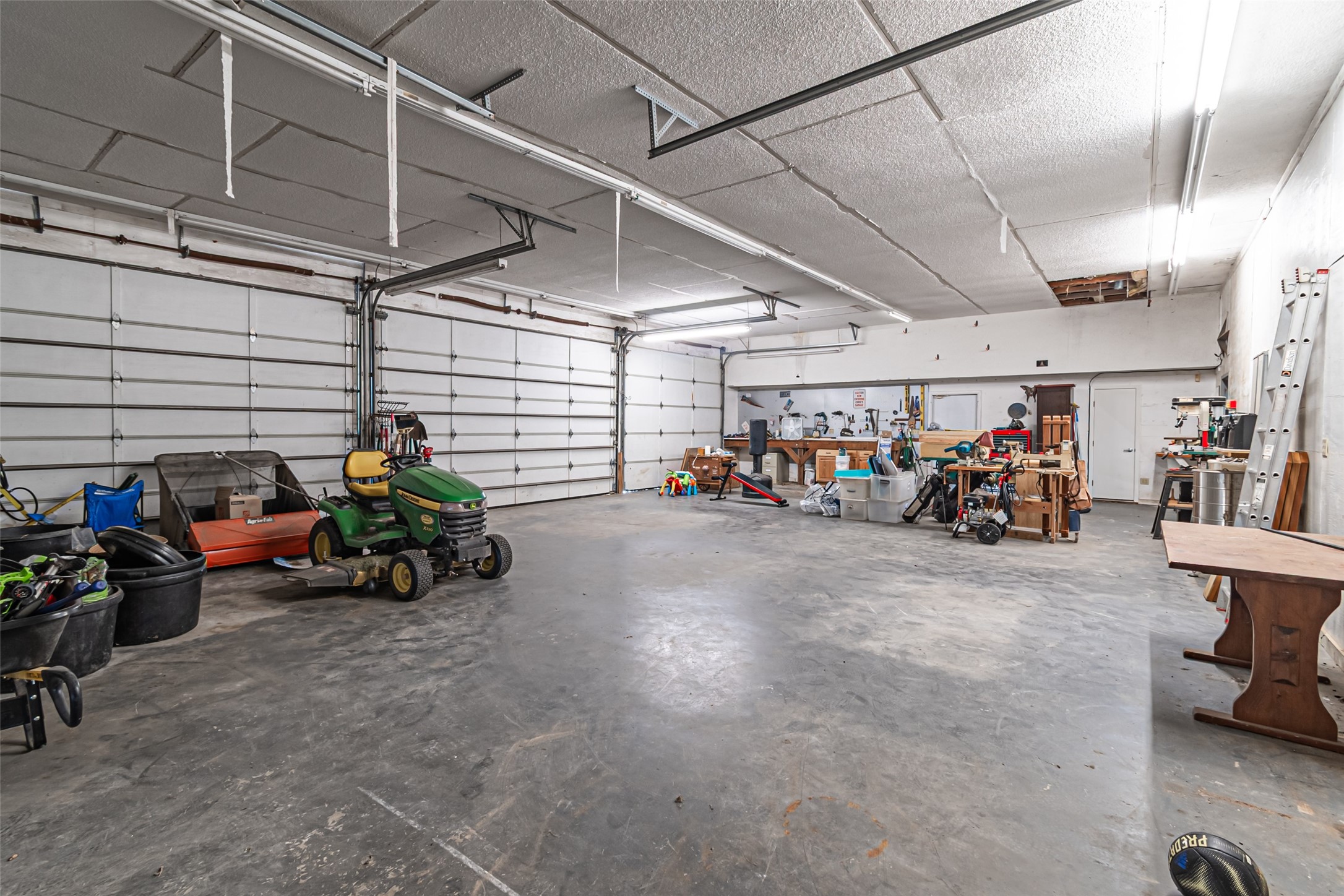 38766 Wyatt Chapel Road Hempstead, TX 77445 - Photo 39 of 45 Garage/workshop, five overhead doors and a full bath including a separate sink area.