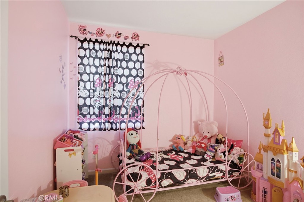 450 Beckman Way Merced, CA 95348 - Photo 15 of 22 a bed room with a bed and a couch