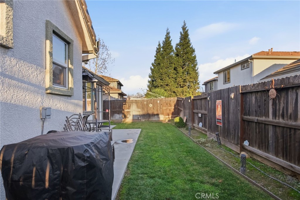 450 Beckman Way Merced, CA 95348 - Photo 21 of 22 a view of a house with a yard