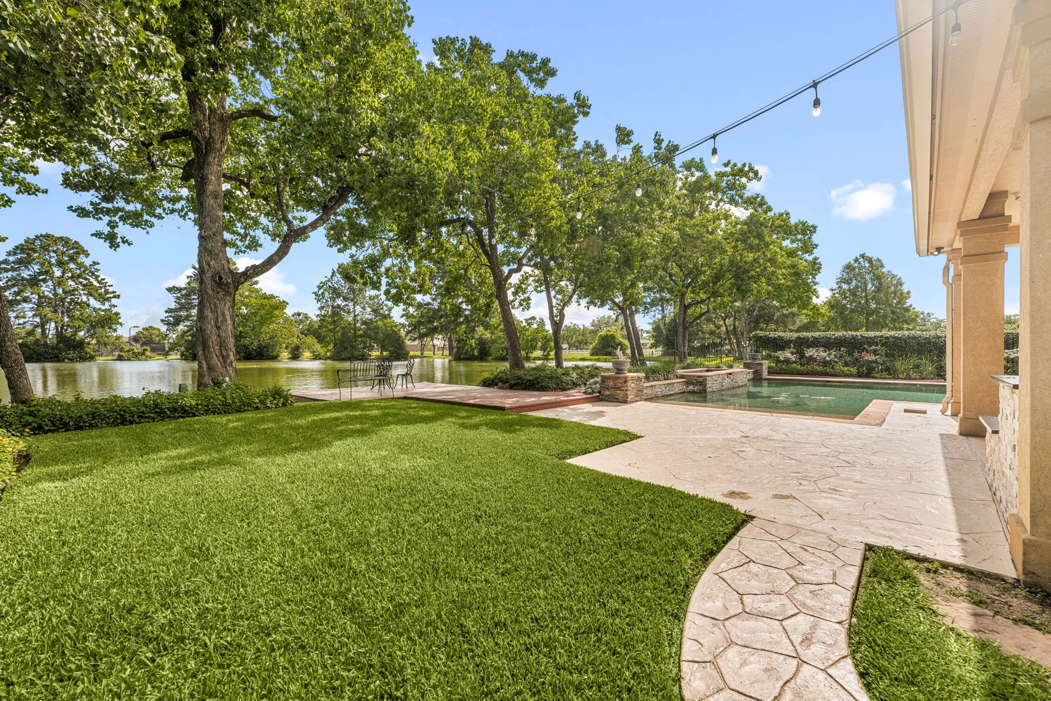 6006 Valhalla Drive Spring, TX 77379 - Photo 38 of 44 Expansive backyard with mature trees leading to your private lakefront setting.