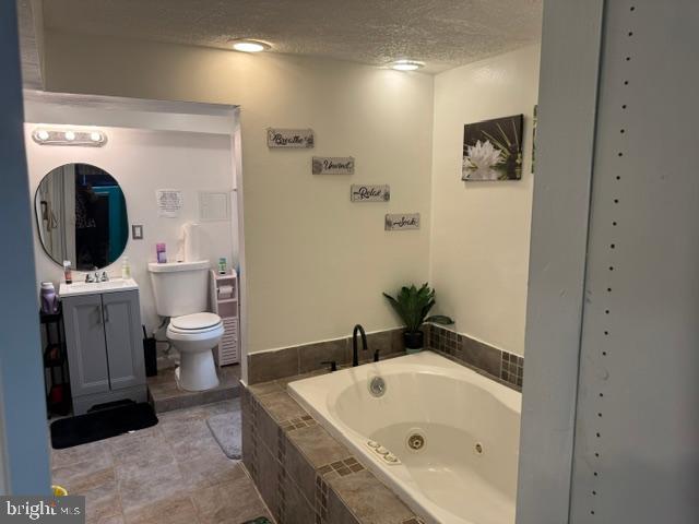 4603 Raleigh Road Temple Hills, MD 20748 - Photo 12 of 40 a bathroom with a bathtub sink and toilet