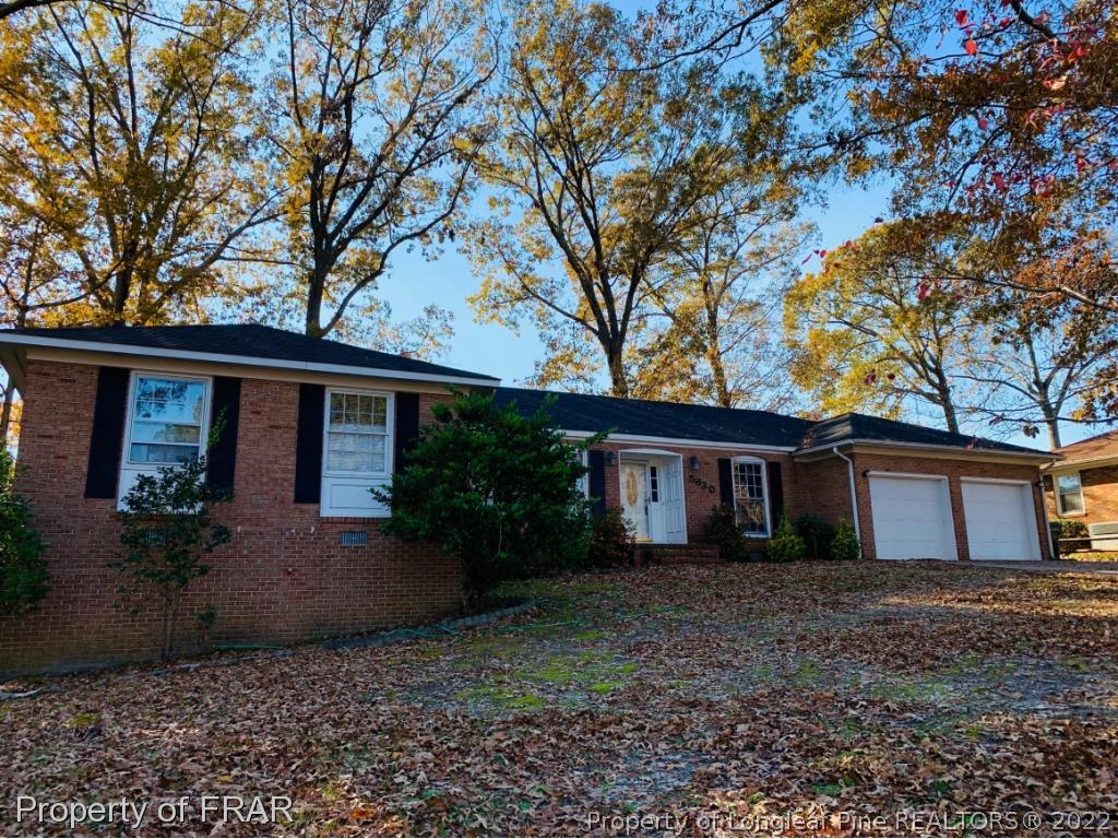5630 Weatherford Road Fayetteville, NC 28303 - Photo 1 of 16 a front view of a house with garden