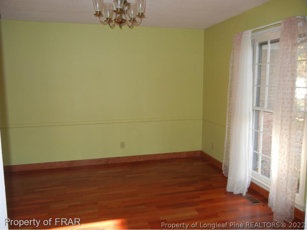 5630 Weatherford Road Fayetteville, NC 28303 - Photo 2 of 16 a view of a room with wooden floor and a window