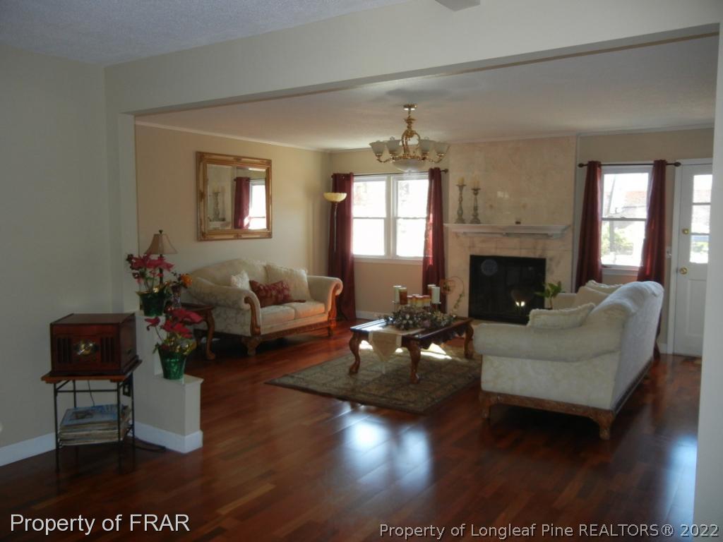 5630 Weatherford Road Fayetteville, NC 28303 - Photo 3 of 16 a living room with furniture fireplace and a window