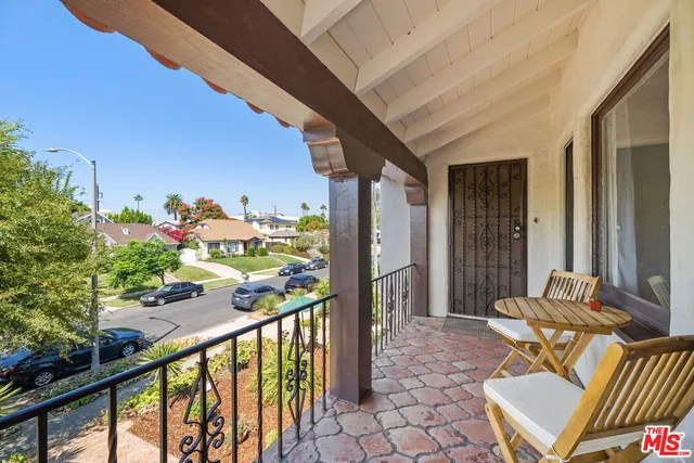 a view of balcony with furniture