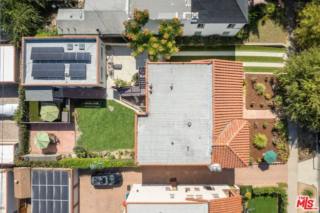 an aerial view of a house with a swimming pool