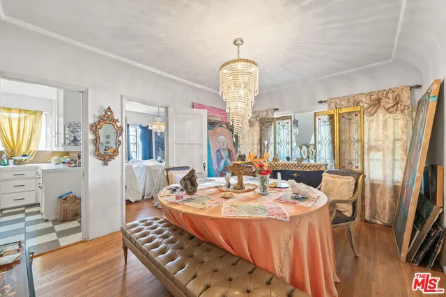 a room with a sink a window and a mirror