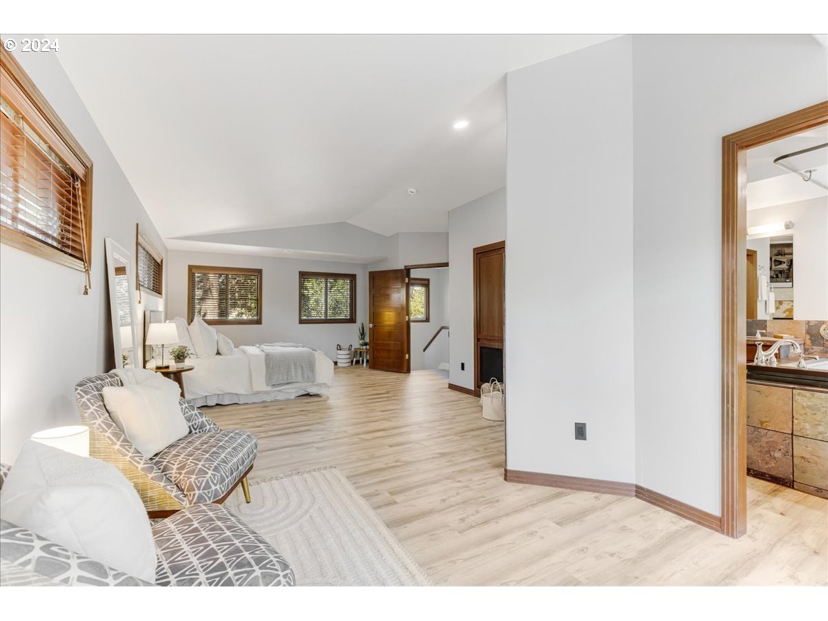 4820 Southwest Marigold Street Portland, OR 97219 - Photo 13 of 34 a living room with furniture and wooden floor