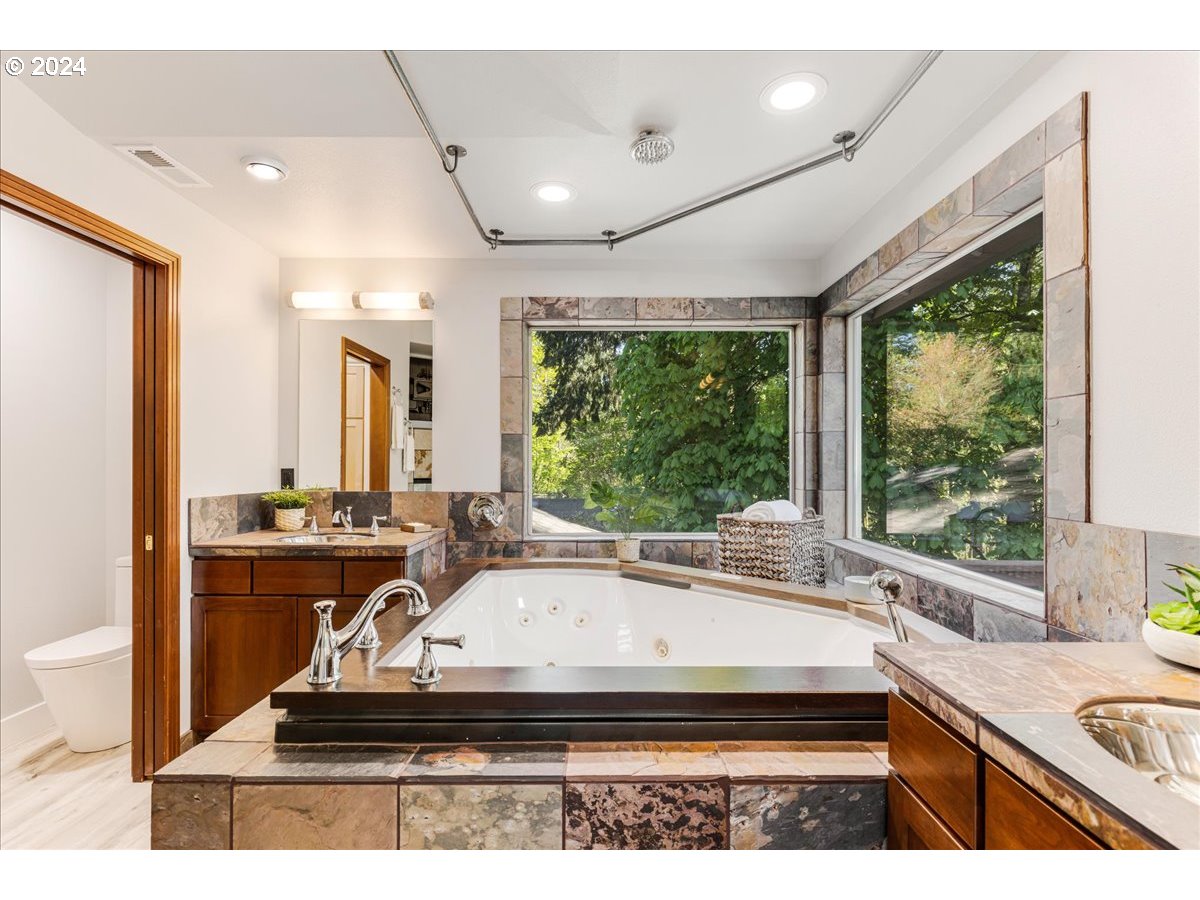 4820 Southwest Marigold Street Portland, OR 97219 - Photo 14 of 34 a kitchen with sink and view living room