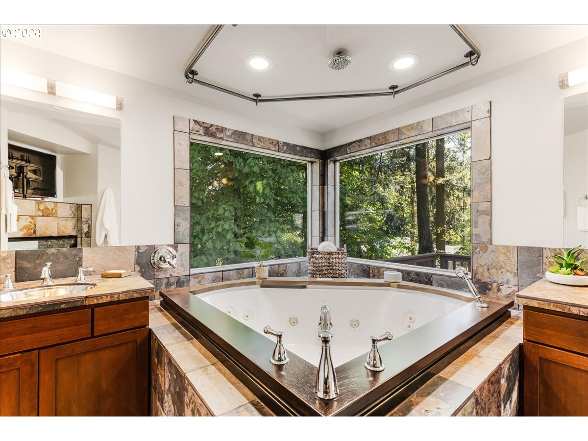 4820 Southwest Marigold Street Portland, OR 97219 - Photo 15 of 34 a bathroom with a sink and large window