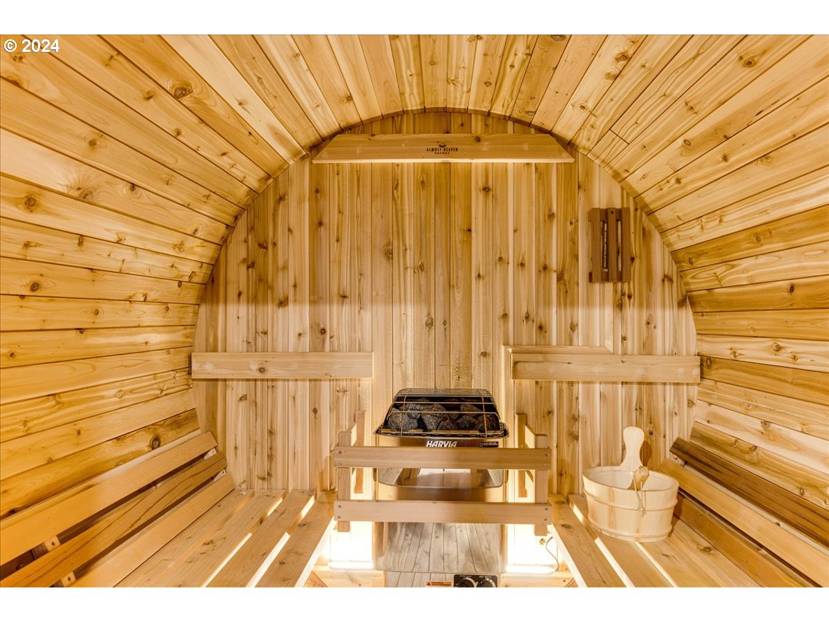 4820 Southwest Marigold Street Portland, OR 97219 - Photo 22 of 34 a picture of a bathroom with a bathtub and a shower