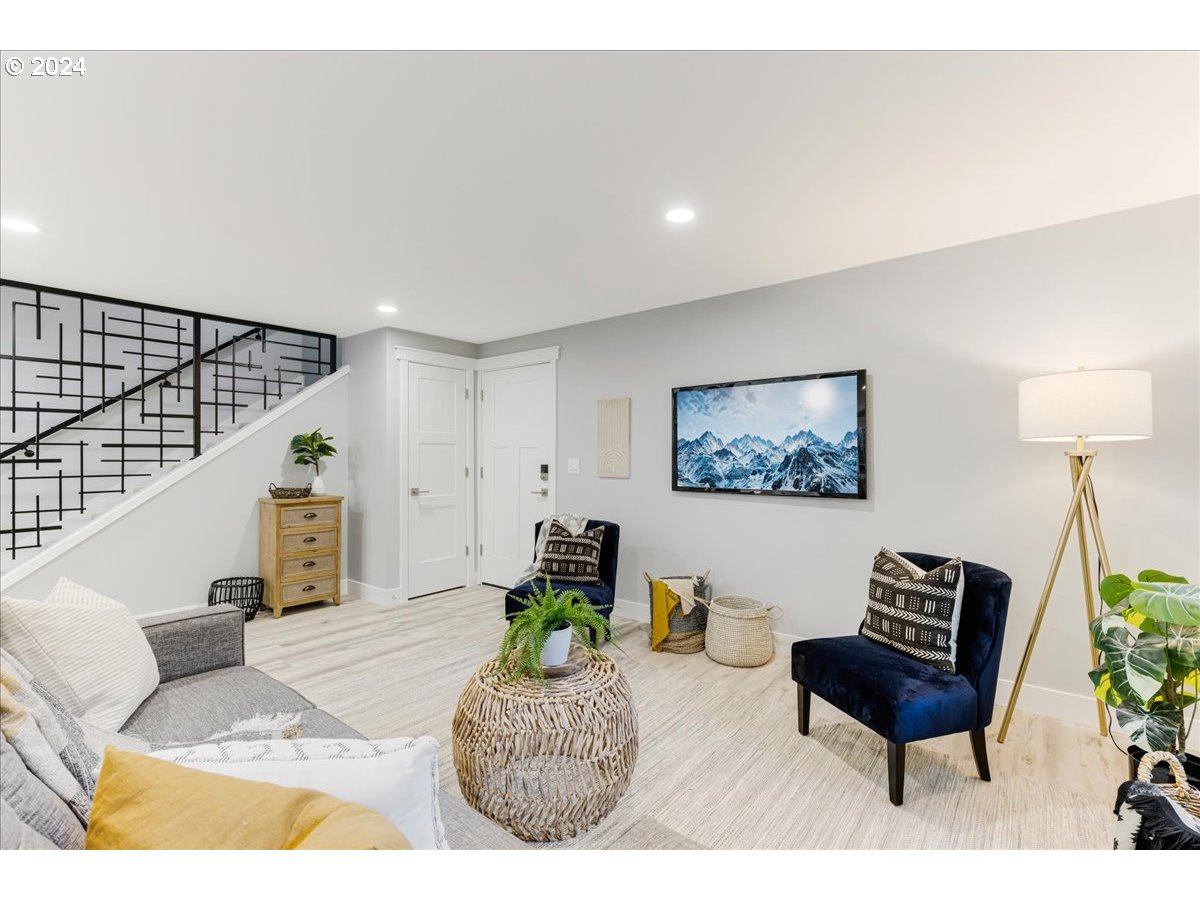4820 Southwest Marigold Street Portland, OR 97219 - Photo 8 of 34 a living room with furniture and a potted plant