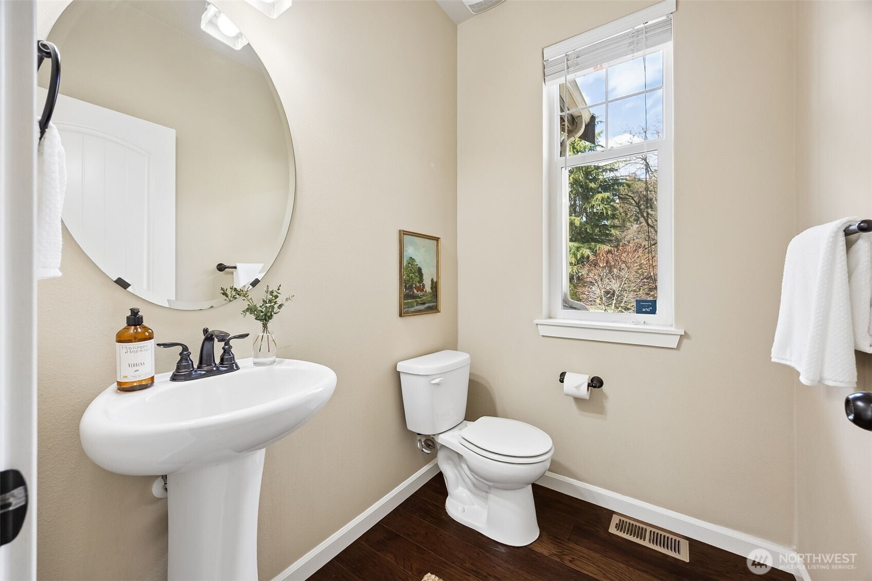 4703 Prestwick Lane Southeast Lacey, WA 98513 - Photo 18 of 40 a bathroom with a toilet sink and mirror