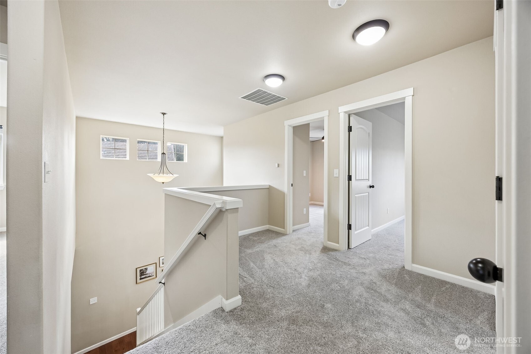4703 Prestwick Lane Southeast Lacey, WA 98513 - Photo 20 of 40 a view of entryway with kitchen and white doors