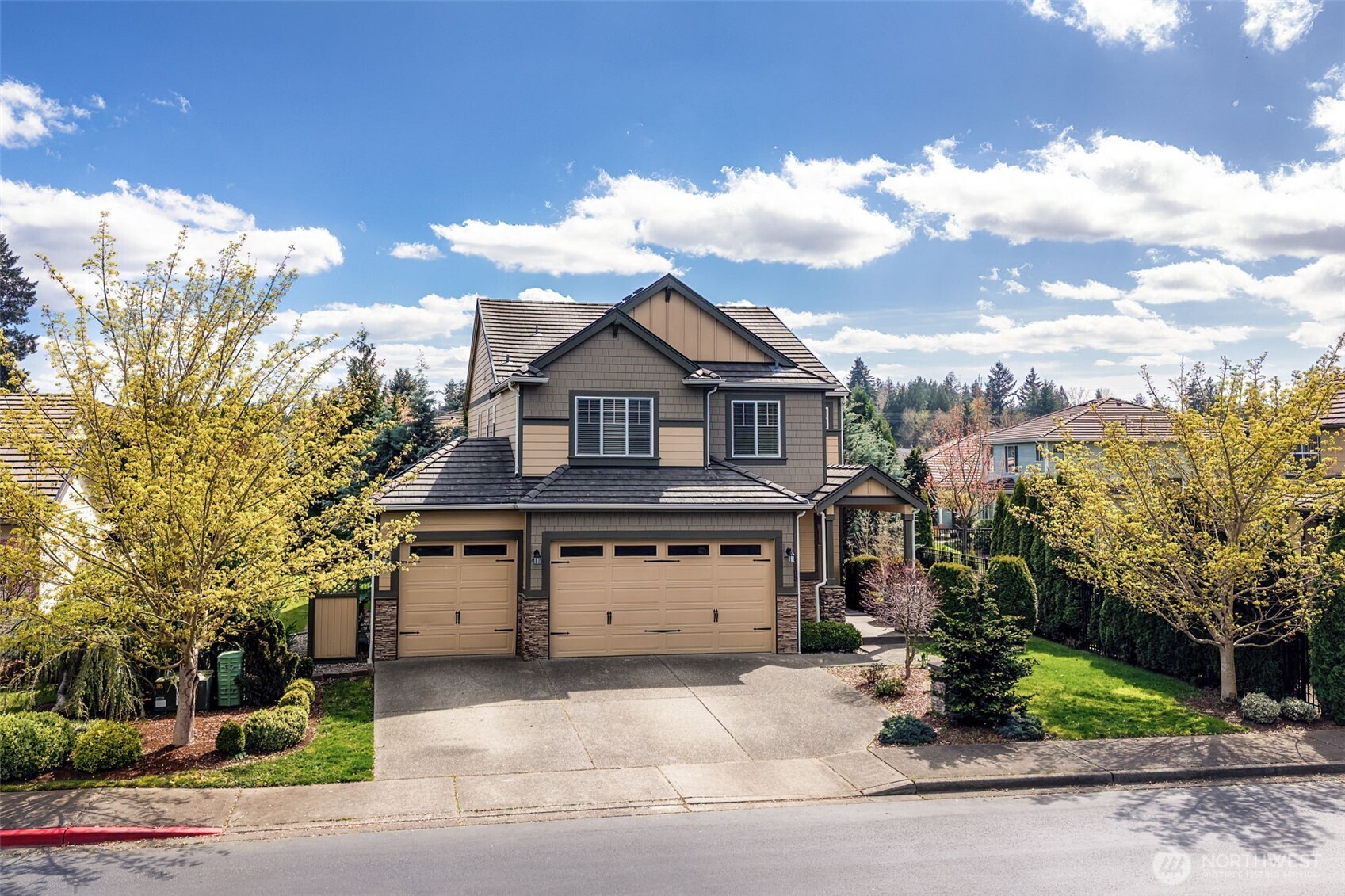 4703 Prestwick Lane Southeast Lacey, WA 98513 - Photo 2 of 40 a front view of a house with a yard and garage