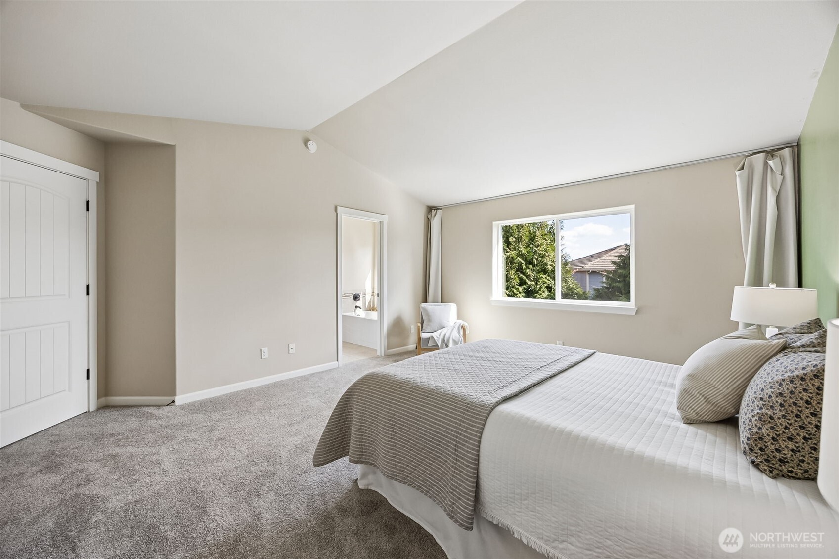 4703 Prestwick Lane Southeast Lacey, WA 98513 - Photo 22 of 40 a bedroom with a large bed and a window