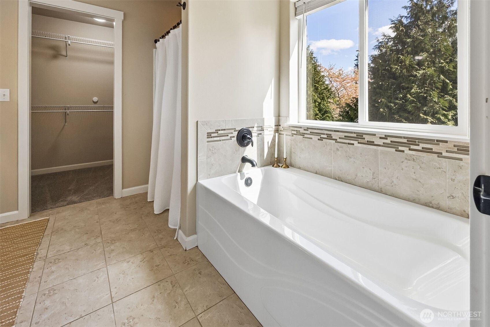 4703 Prestwick Lane Southeast Lacey, WA 98513 - Photo 24 of 40 a spacious bathroom with a bathtub and shower