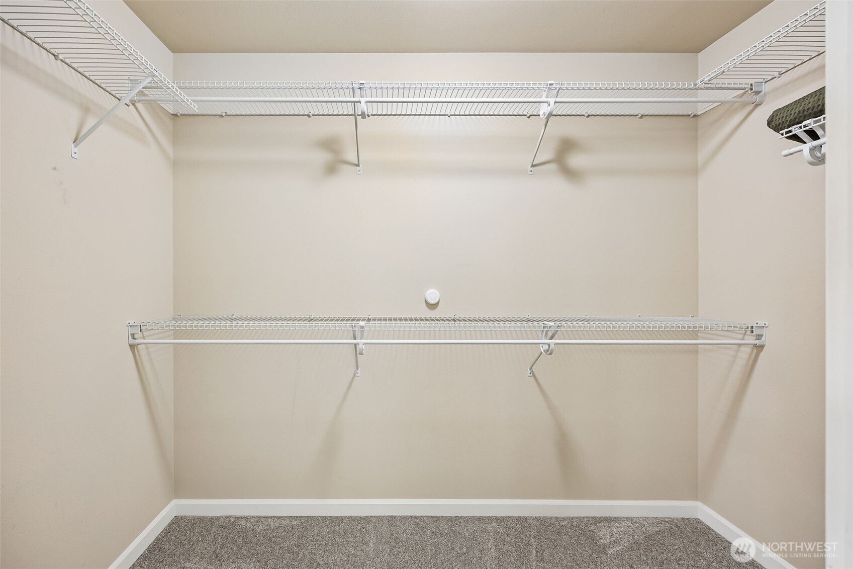 4703 Prestwick Lane Southeast Lacey, WA 98513 - Photo 25 of 40 a view of a room with racks on the wall