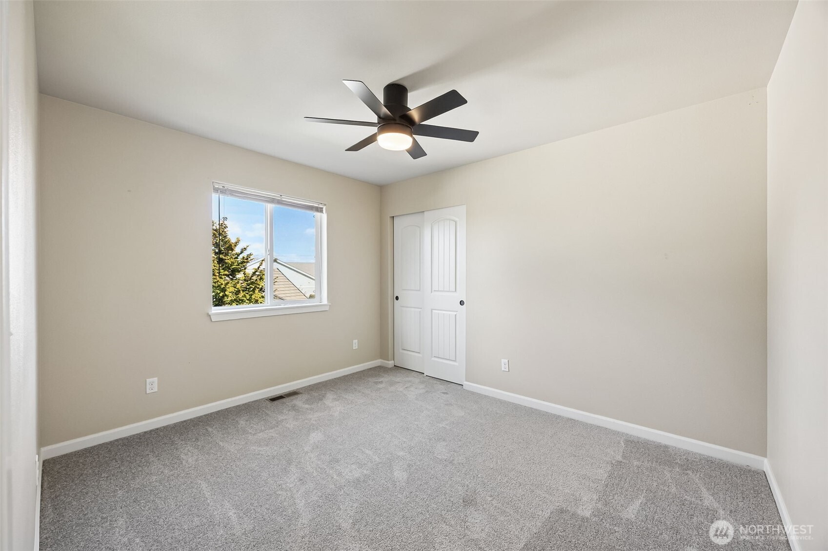 4703 Prestwick Lane Southeast Lacey, WA 98513 - Photo 26 of 40 an empty room with windows and ceiling fan