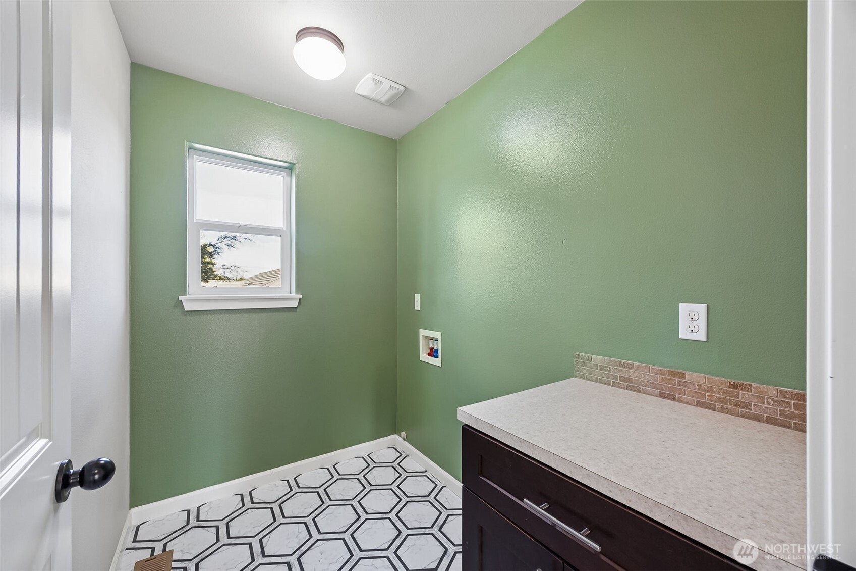 4703 Prestwick Lane Southeast Lacey, WA 98513 - Photo 30 of 40 a bathroom with a sink a mirror and a toilet