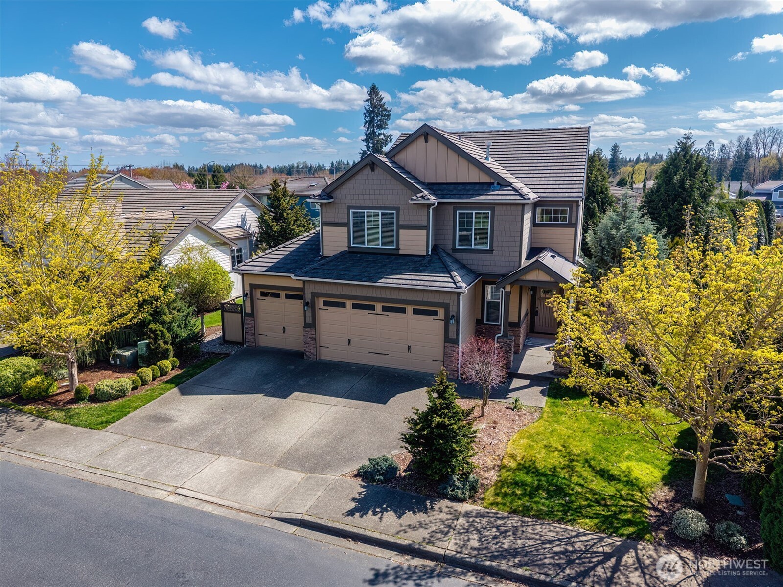 4703 Prestwick Lane Southeast Lacey, WA 98513 - Photo 3 of 40 a front view of a house with a yard and potted plants