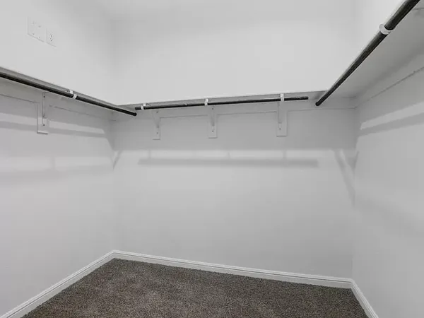 a view of an empty walk in closet