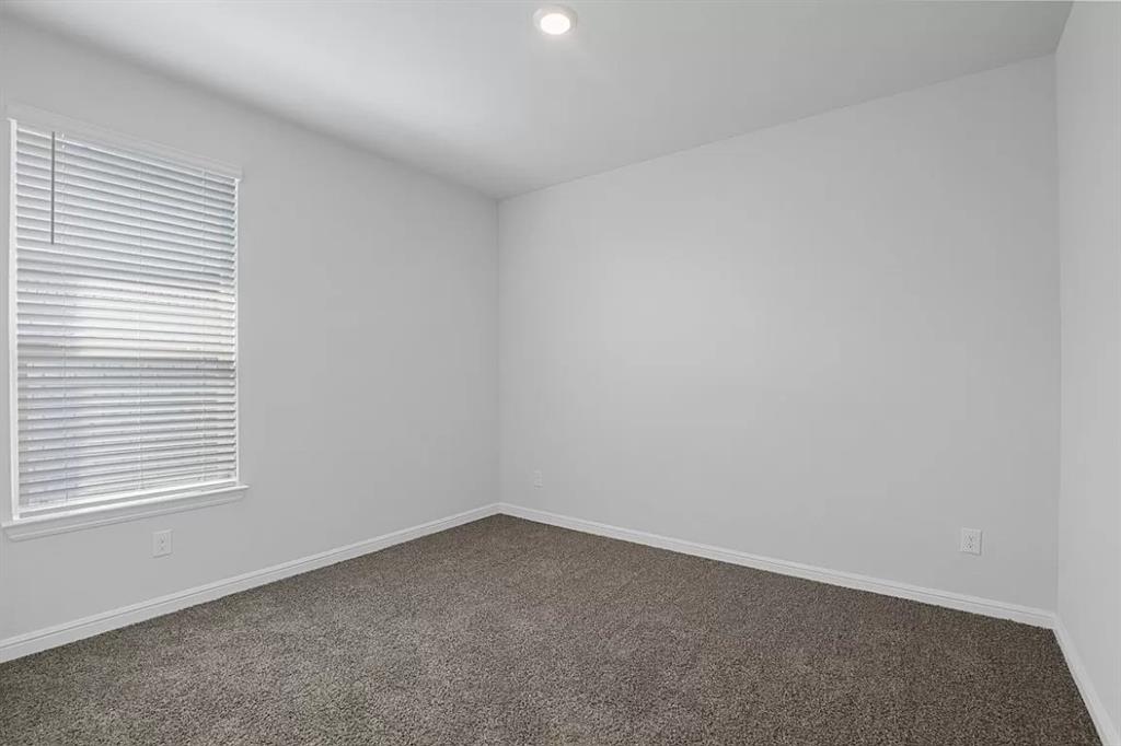 5229 Boulder Vly Drive Fort Worth, TX 76179 - Photo 25 of 39 an empty room with a window