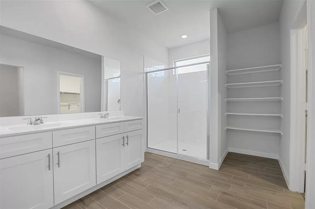 5229 Boulder Vly Drive Fort Worth, TX 76179 - Photo 30 of 39 a bathroom with a double vanity sink and a mirror