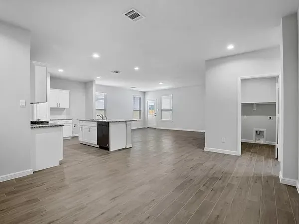 a view of kitchen with wooden floor
