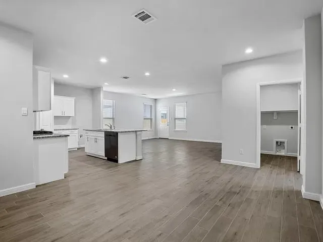 a view of kitchen with wooden floor