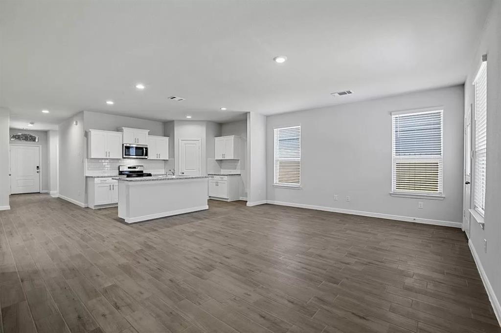 5229 Boulder Vly Drive Fort Worth, TX 76179 - Photo 6 of 39 a view of kitchen with wooden floor and electronic appliances