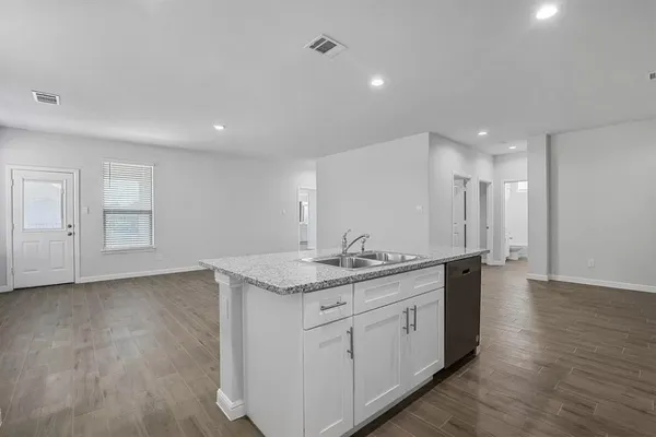 a view of a kitchen counter top space and stainless steel appliances