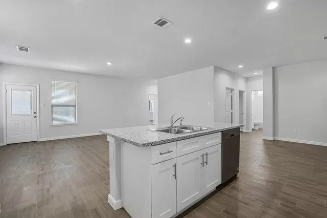 a view of a kitchen counter top space and stainless steel appliances