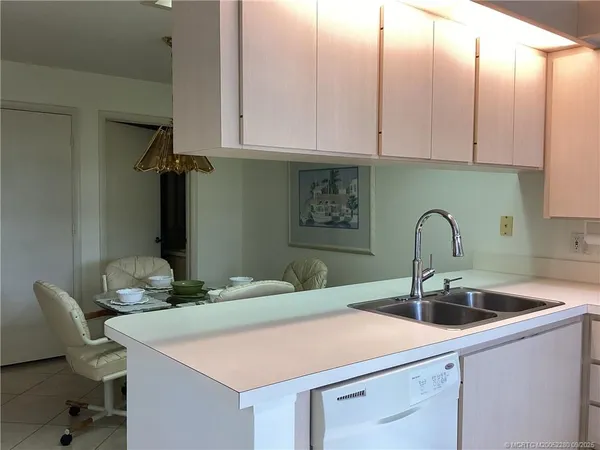 a kitchen with a sink and a microwave